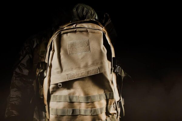 Close-up view of army brown tactical backpack Close-up view of army brown tactical backpack