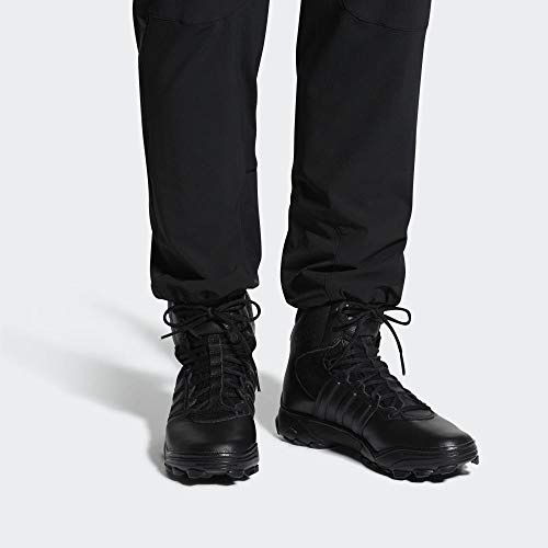 Man wearing black trousers and black tactical boots