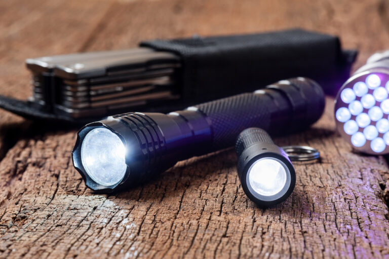 Two black tactical flashlights of different sizes