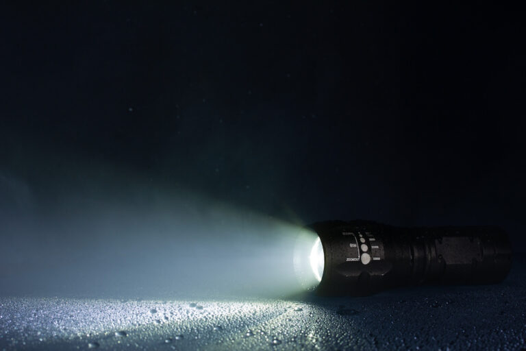 Black tactical flashlight with strong illumination Black tactical flashlight with strong illumination