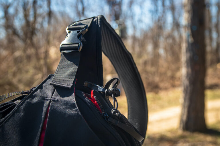 Close-up view of black tactical sling bag